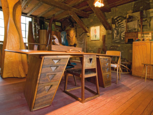 Made from American walnut with exotic-wood decorative elements, Esherick’s 1939 flat top desk, with its matching chair, was inspired by the humble sawhorse. Photo by James Mario. 