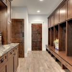 Knotty alder custom doors and cabinetry in the mudroom of a Minneapolis house by Divine Custom Homes. Photograph by Spacecrafting.com.