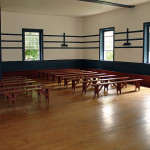 The Meeting at Pleasant Hill is column-free thanks to the ingenious system of cantilevered oak trusses architect Micajah Burnett devised to support the roof and ceiling. The floor is ash; the painted benches and trim are poplar.