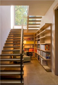 Wade Design Architects, working with Total Concepts homebuilders, created a library and reading area under the main stairs in a Bennett Valley, California weekend house. Photography by John Costill & Paul Dyer