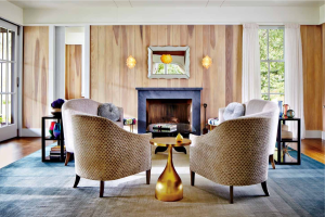 Poplar siding lines the walls of a living room in Atherton, CA, designed by New York–based architect Rebecca Asher.