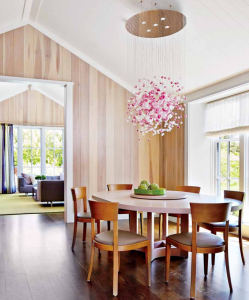 The dining room table was given a custom walnut finish to complement the chairs, which are also oak, and the floor, which is wide-plank American walnut.