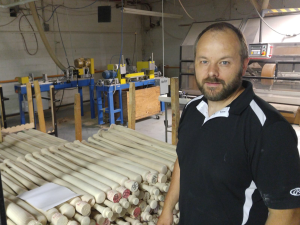 Rawlings baseball bat plant manager Ron Vander Groef says that the white ash they use could be wiped out in the next few years. Photograph: Brian Mann/North Country Public Radio