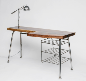 Skana Design’s black walnut writing desk has a handmade stainless-steel base and lamp by metalworker Jason Roche.