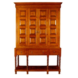 Shown in tiger maple, the William & Mary-style entertainment center features barley-twist legs and raised paneling on the bi-fold doors.